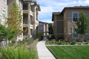 Exterior of Geneva Pointe with sidewalk and trees and foliage