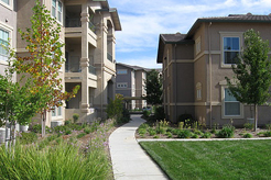 Exterior of Geneva Pointe with sidewalk and trees and foliage
